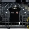 Tricou de antrenament Gloria Bistrița, croială de femei, bumbac, negru — fața, cu stema clubului și sigla județului.